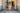 Small Dog standing in a doorway