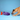 Dog interacting with a purple fish-shaped toy on a blue background