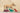 Dog chasing toy dinosaurs on a wooden surface with a neutral background