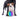 A small white and tan dog stands in front of a larger black dog on a white studio background, with a colorful striped ball on the ground between them.